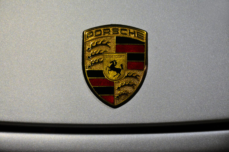 Porsche Badge on a Silver Background